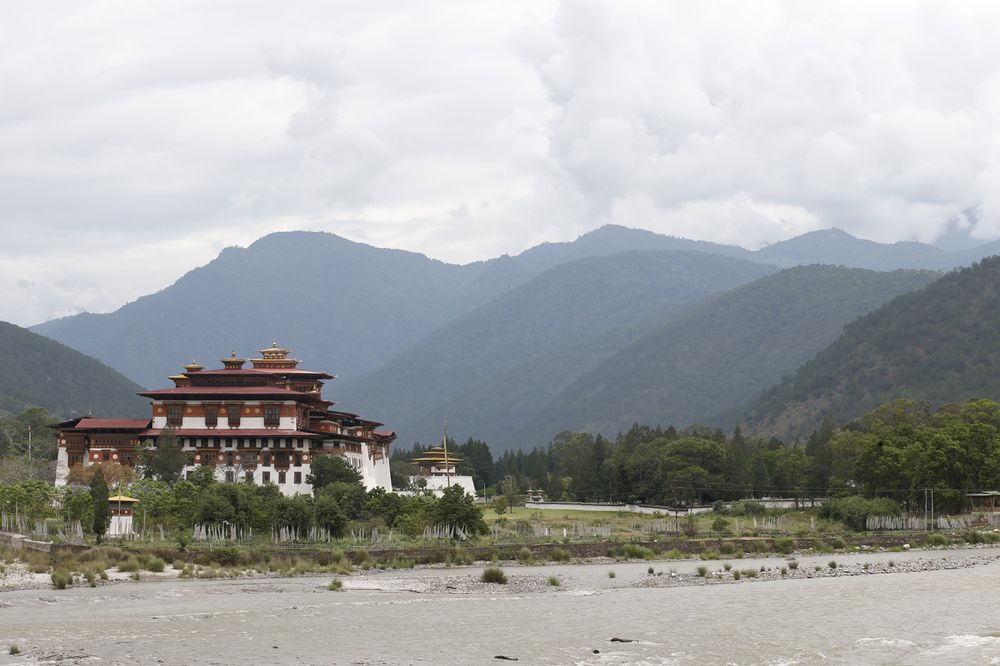 Punakha Dzong framed by the Punakha valley and mountains